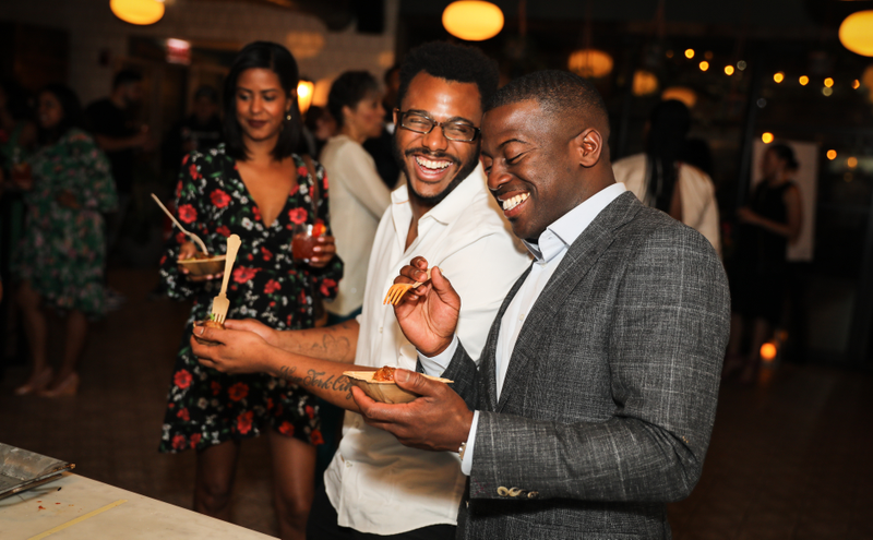 Chefs Kwame Onwuachi and Eduardo Jordan share a laugh during the IDE All-Star Culinary Bash on May 5, 2018, at Soho House Chicago in Chicago.